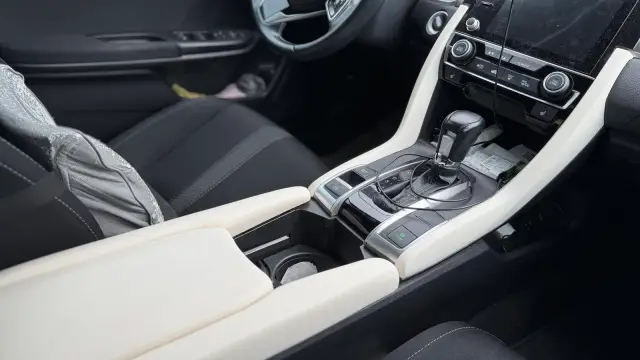 Honda Civic interior with new white centre console trim fitted around the shifter